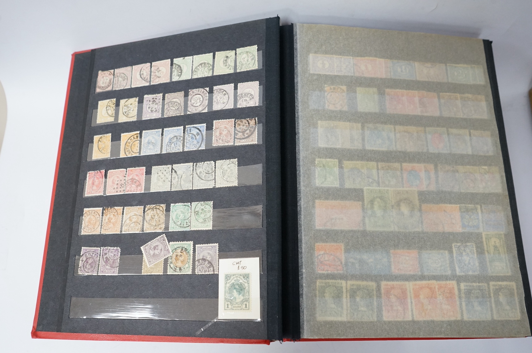 Four albums of stamps each: Holland, New Zealand, Borneo etc (4). Condition - mostly stamp marked.